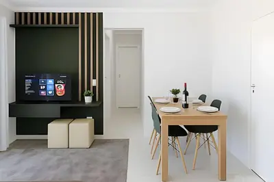 Uma televisão e/ou sistema de entretenimento em Apartamento 8º andar com Garagem e Churrasqueira