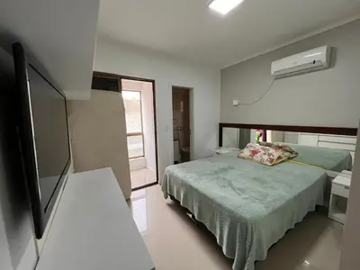 Uma cama ou camas num quarto em Apartamento de Praia em Itapema