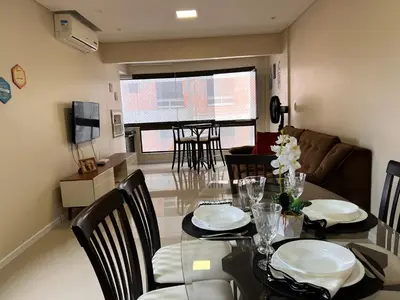Uma televisão e/ou sistema de entretenimento em Apartamento de Praia em Itapema