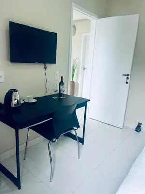Uma televisão e/ou sistema de entretenimento em MarisC&LHouse 1- Quarto casal