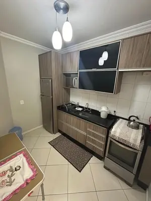 A cozinha ou kitchenette de Apartamento 3 quartos em Bombinhas a apenas 100 metros da praia