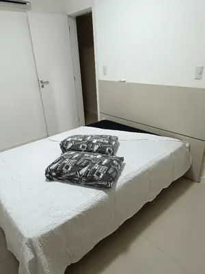 Uma cama ou camas num quarto em Lindo Apartamento vista MAR Itapema