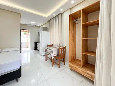Uma cama ou camas num quarto em Loft Sol e Mar Exclusivo em Bombinhas 50m da praia