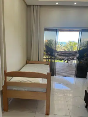Uma cama ou camas num quarto em Loft Sol e Mar Exclusivo em Bombinhas 50m da praia