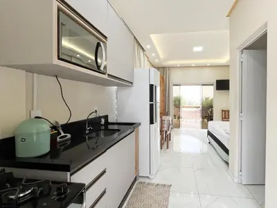 A cozinha ou kitchenette de Loft Sol e Mar Exclusivo em Bombinhas 50m da praia