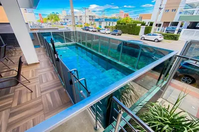 A piscina em ou perto de Apto retrô na Praia de Palmas - 0184