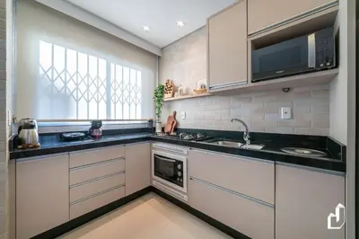 A cozinha ou kitchenette de Condomínio com piscina e saída direta para a praia