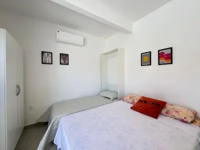Uma cama ou camas num quarto em Apto térreo em Tijucas n 04