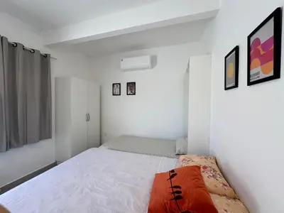 Uma cama ou camas num quarto em Apto térreo em Tijucas n 04