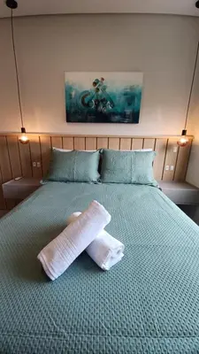 Uma cama ou camas num quarto em Apartamento na praia de Palmas em Governador Celso Ramos
