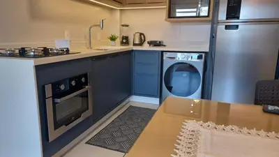 A cozinha ou kitchenette de Apartamento na praia de Palmas em Governador Celso Ramos
