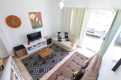 Uma televisão e/ou sistema de entretenimento em cod 138 Apartment townhouse Bombas Beach