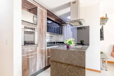 A cozinha ou kitchenette de Apartamento a 200m da Praia de Bombas