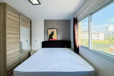 Uma cama ou camas num quarto em Praia de Palmas - 400 metros da praia - 0479