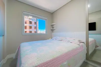 Uma cama ou camas num quarto em Praia de Palmas - Imóvel Amplo e novo - 0492
