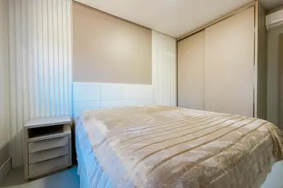 Uma cama ou camas num quarto em Praia de Palmas - Imóvel Amplo e novo - 0492