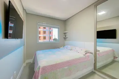 Uma cama ou camas num quarto em Praia de Palmas - Imóvel Amplo e novo - 0492