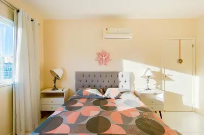 Uma cama ou camas num quarto em Praia de Palmas - Lindo Apto a 450m do Mar - 0493