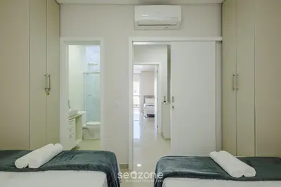 Uma cama ou camas num quarto em Casa c/ 2 Suítes e Churrasqueira LRM0226