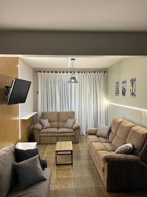 Uma área de estar em Apartamento com 03 dormitórios