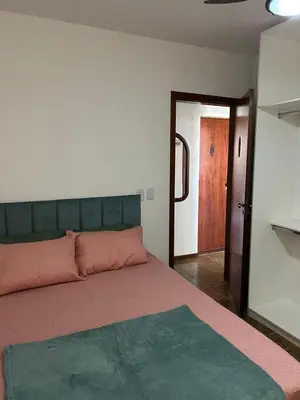 Uma cama ou camas num quarto em Apartamento com 03 dormitórios