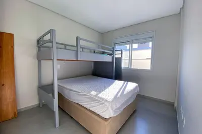 Uma cama ou camas num quarto em Apto térreo garden com jacuzzi privativa - 0488