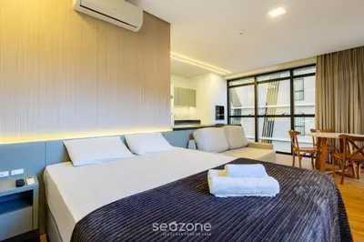 Uma cama ou camas num quarto em Studio c/ churrasqueira a 220m da Praia SFR0302
