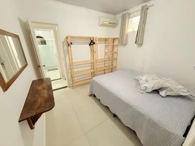 Uma cama ou camas num quarto em Casa Bacupari - 3 Quartos