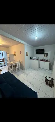 Uma televisão e/ou sistema de entretenimento em Apartamento Varandas 2