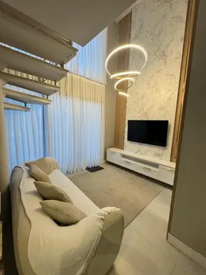 Uma televisão e/ou sistema de entretenimento em #Duplex vista Mar em Canto Grande -Refugio e Mar