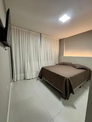 Uma televisão e/ou sistema de entretenimento em #Duplex vista Mar em Canto Grande -Refugio e Mar