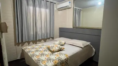 Uma cama ou camas num quarto em Recanto Silveira 150 metros da Praia Canto Grande Mar de Fora( Mariscal )