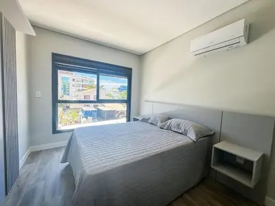 Uma cama ou camas num quarto em Praia de Palmas - 100m do Mar em Prédio Novo - 0188