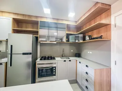 A cozinha ou kitchenette de Praia de Palmas - 100m do Mar em Prédio Novo - 0188