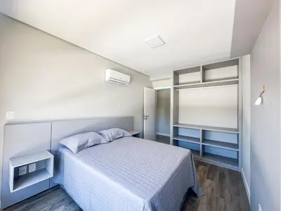 Uma cama ou camas num quarto em Praia de Palmas - 100m do Mar em Prédio Novo - 0188