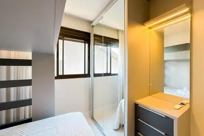 Uma cama ou camas num quarto em Apto alto padrão frente mar - 0354