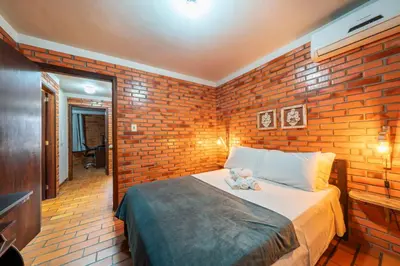 Uma cama ou camas num quarto em Casa aconchegante perto da praia HN6078