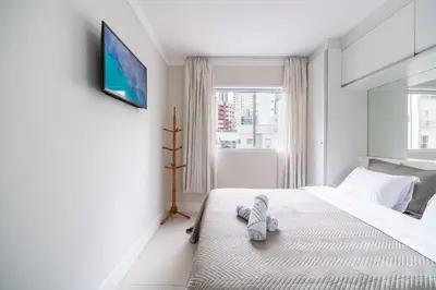 Uma cama ou camas num quarto em Turim 2 Suítes Quadra Mar by Achei Camboriú