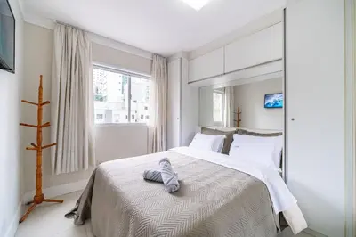 Uma cama ou camas num quarto em Turim 2 Suítes Quadra Mar by Achei Camboriú