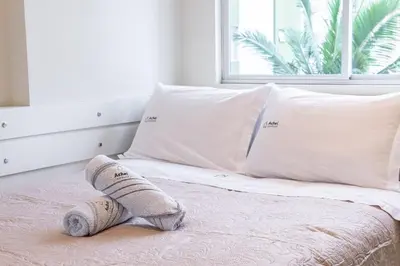 Uma cama ou camas num quarto em Turim 2 Suítes Quadra Mar by Achei Camboriú