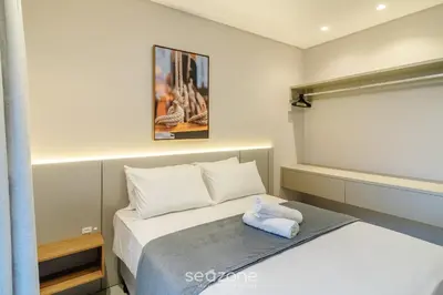 Uma cama ou camas num quarto em Sua estadia exclusiva a poucos passos do Mar em Meia Praia - FFS