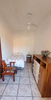 Uma cama ou camas num quarto em Casa Ensolarada