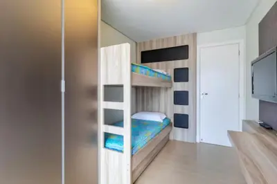 Uma cama ou camas num quarto em Cobertura com jacuzzi 2 minutos da praia