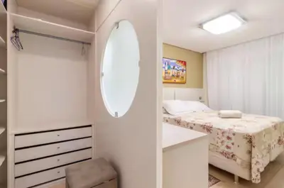 Uma cama ou camas num quarto em Cobertura com jacuzzi 2 minutos da praia