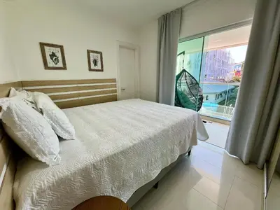 Uma cama ou camas num quarto em Residencial Solar das Ilhas - Praia de 4 Ilhas/SC