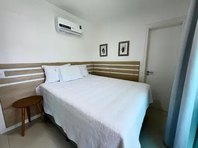 Uma cama ou camas num quarto em Residencial Solar das Ilhas - Praia de 4 Ilhas/SC