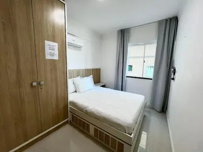 Uma cama ou camas num quarto em Residencial Solar das Ilhas - Praia de 4 Ilhas/SC