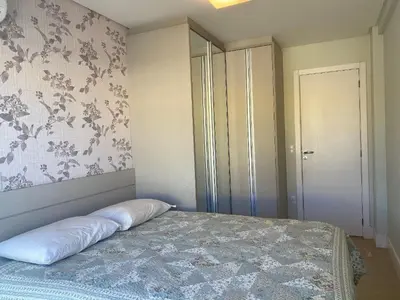 Uma cama ou camas num quarto em 233A - Boulevard Bombinhas 06 pessoas com piscina