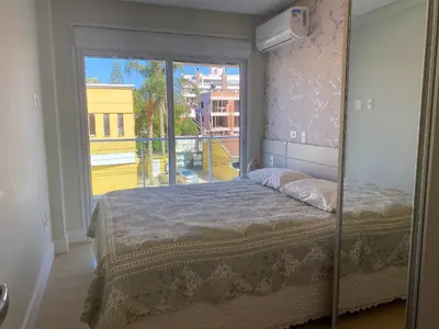Uma cama ou camas num quarto em 233A - Boulevard Bombinhas 06 pessoas com piscina