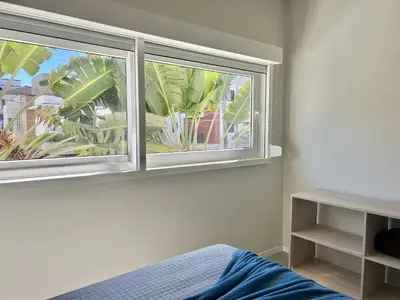 Uma cama ou camas num quarto em Lindo! Apto na praia de Palmas! YR02I